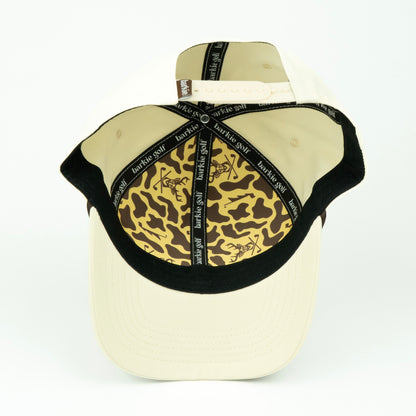 Cream hat with deer and camo inner pattern