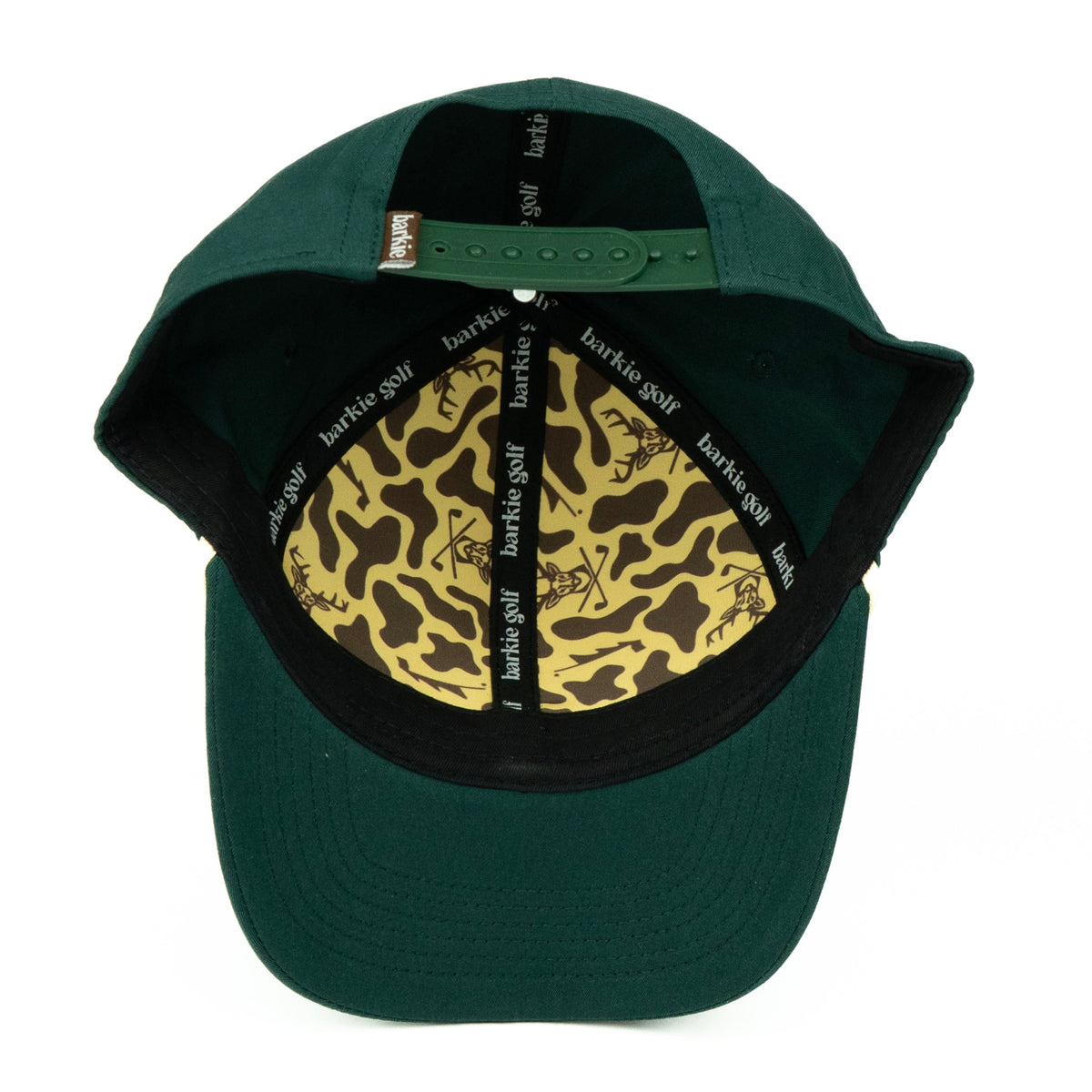 Green cap with camouflage pattern on the interior, featuring 'barkie golf' branding.