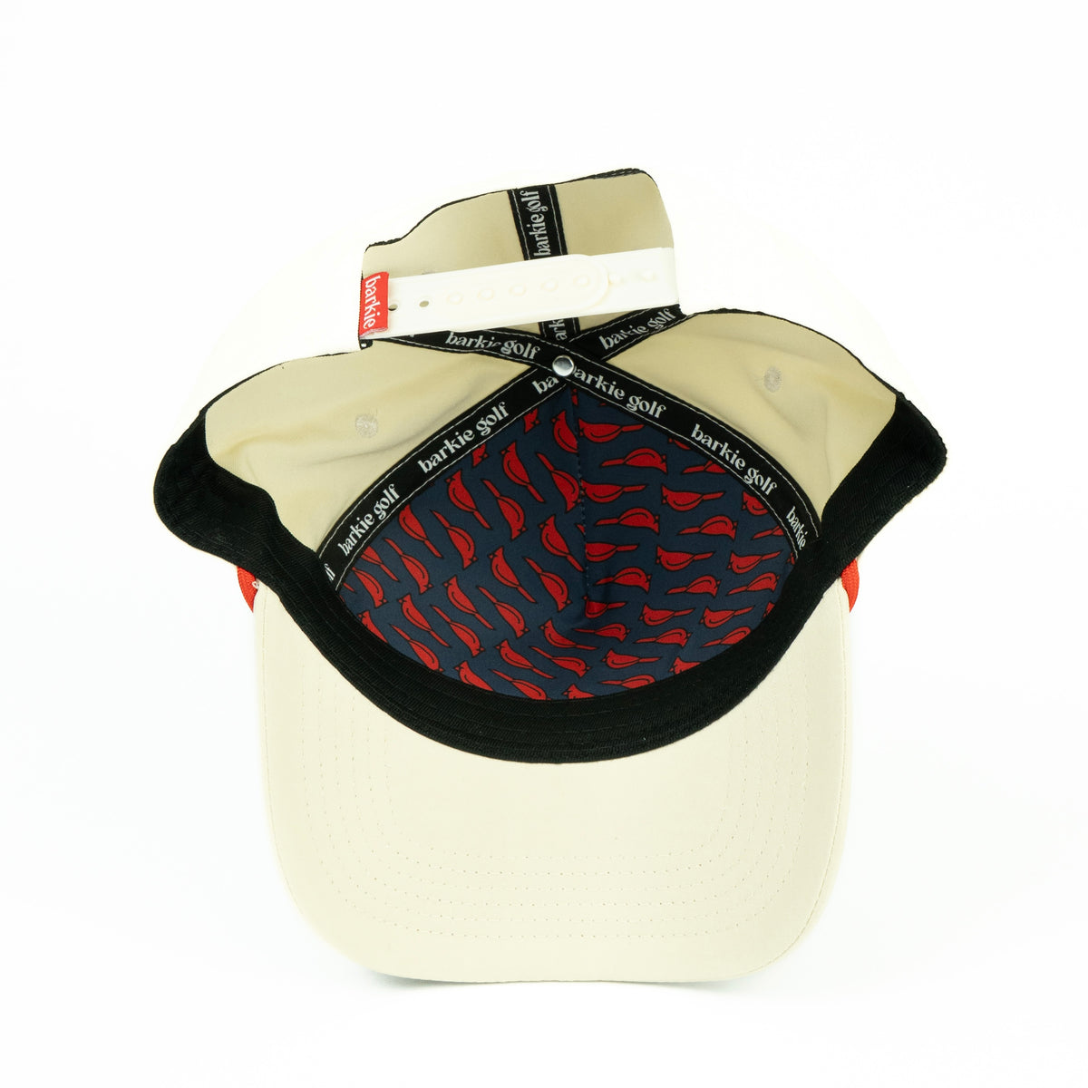 Beige hat with cardinal bird pattern inside
