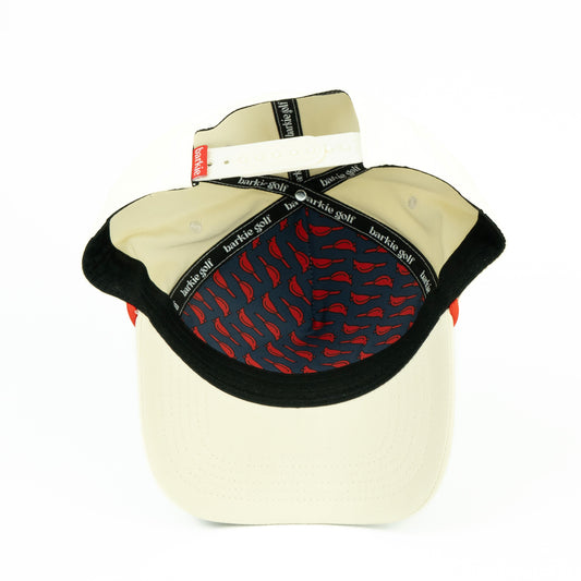 Beige hat with cardinal bird pattern inside